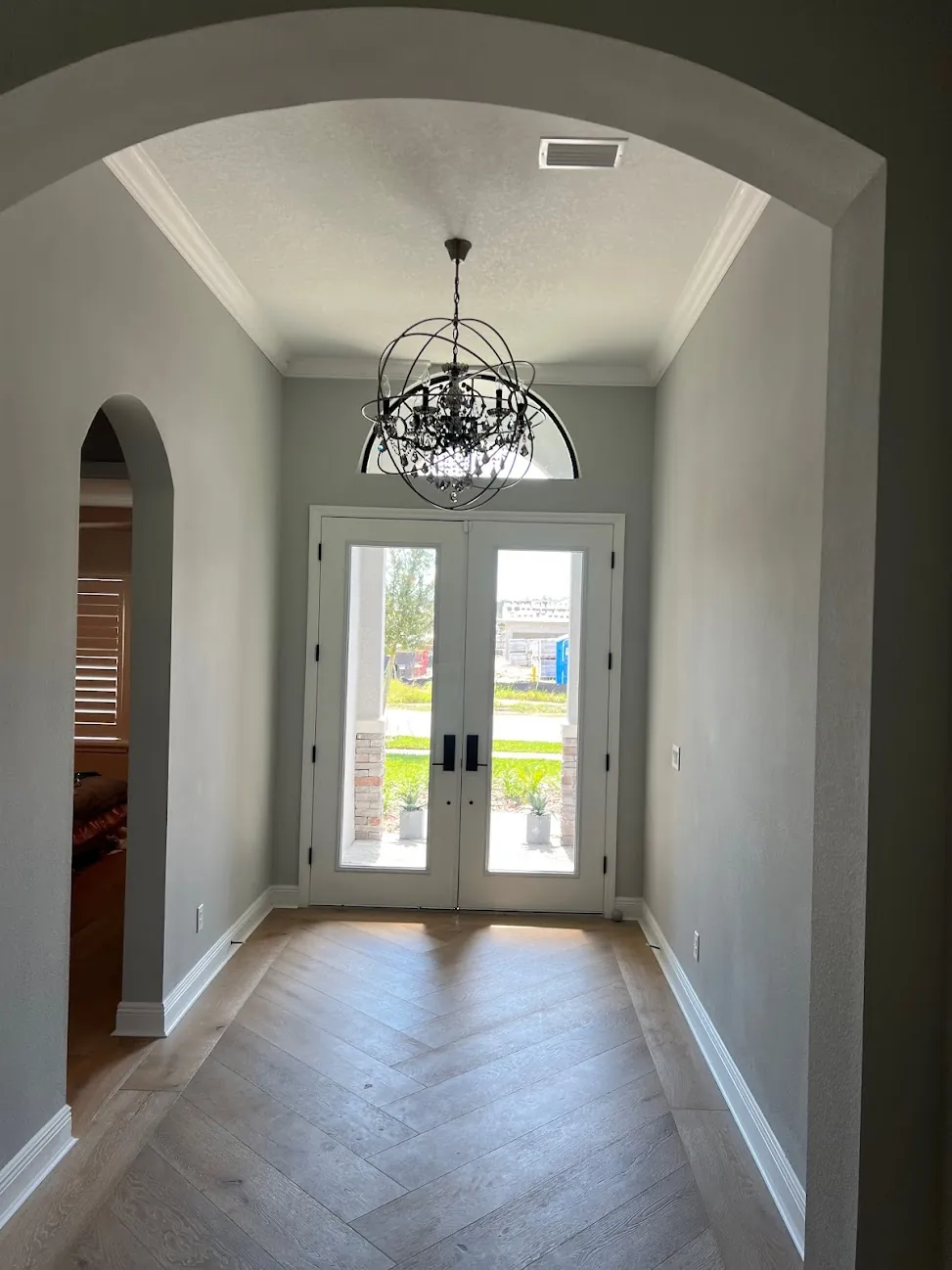 Hardwood herringbone foyer installation Tampa Bay