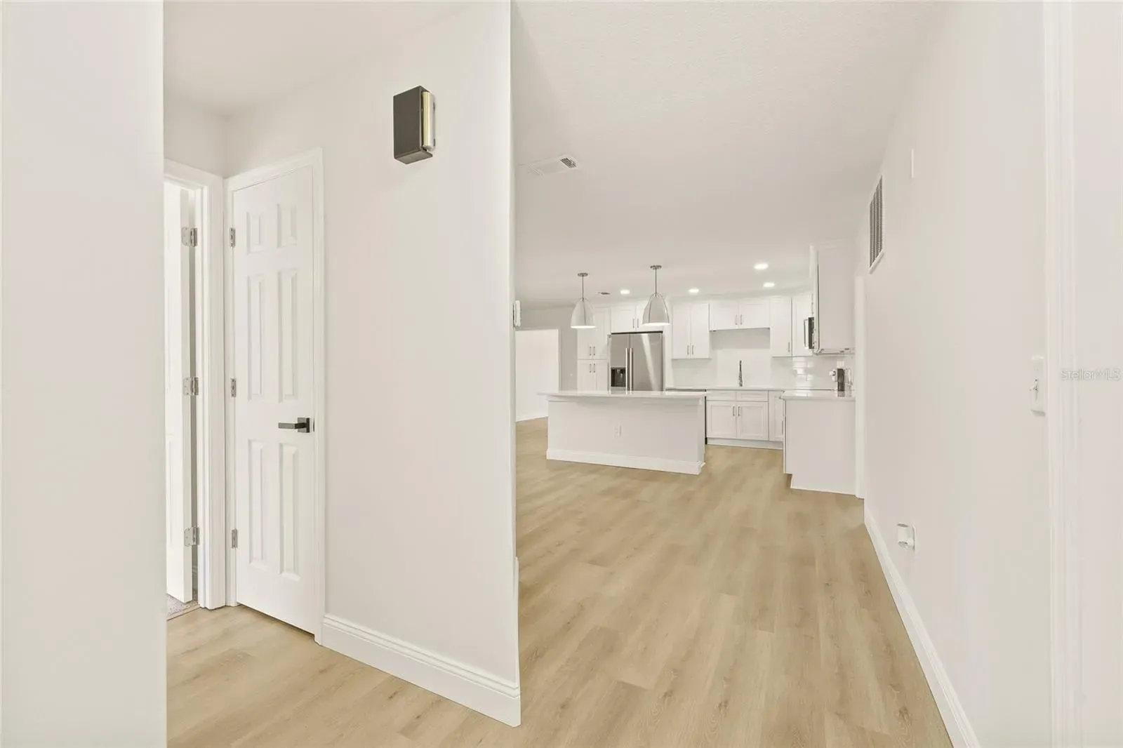 LVP hallway with kitchen view Holiday FL