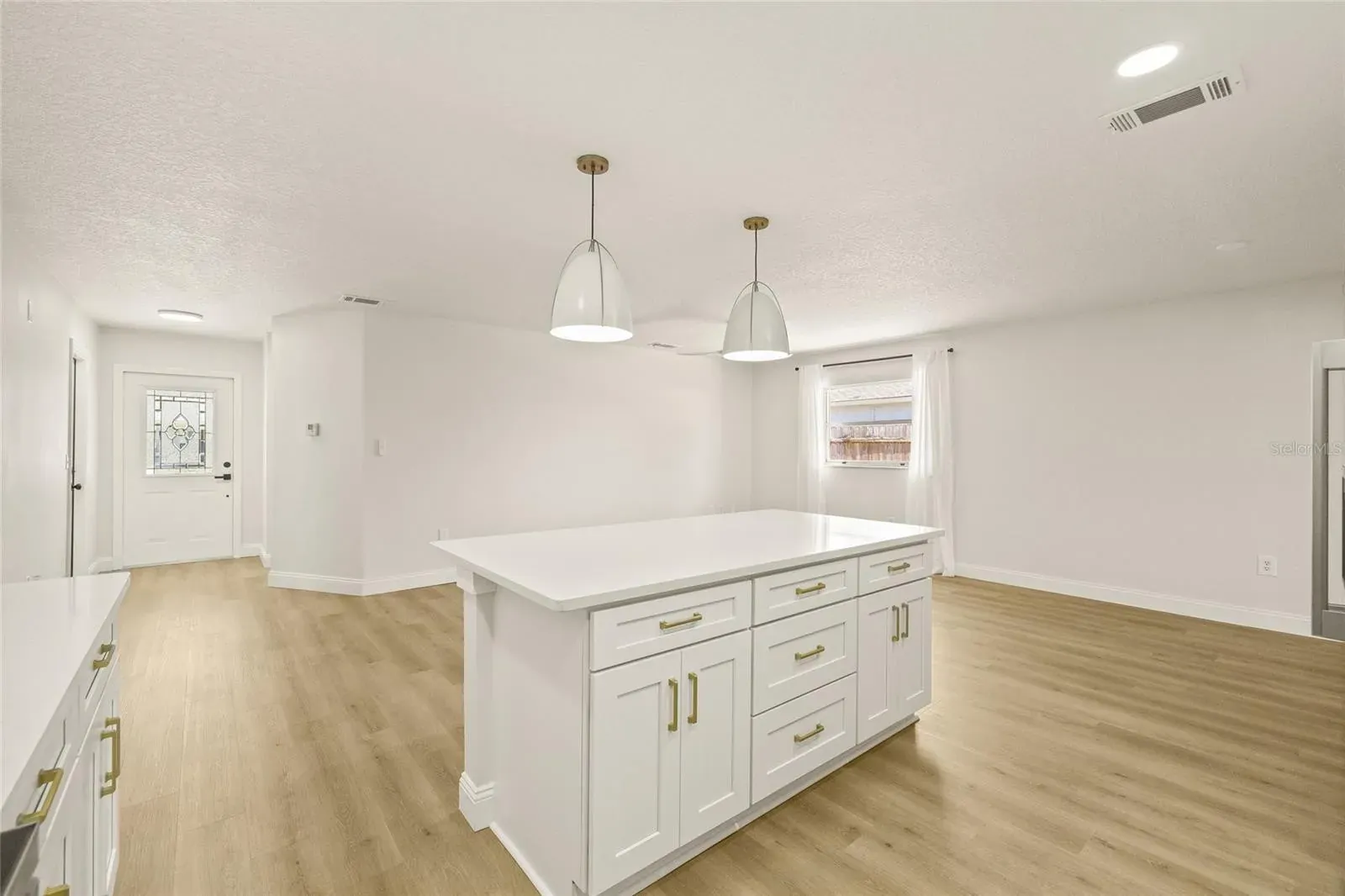 LVP kitchen island gold hardware Holiday FL