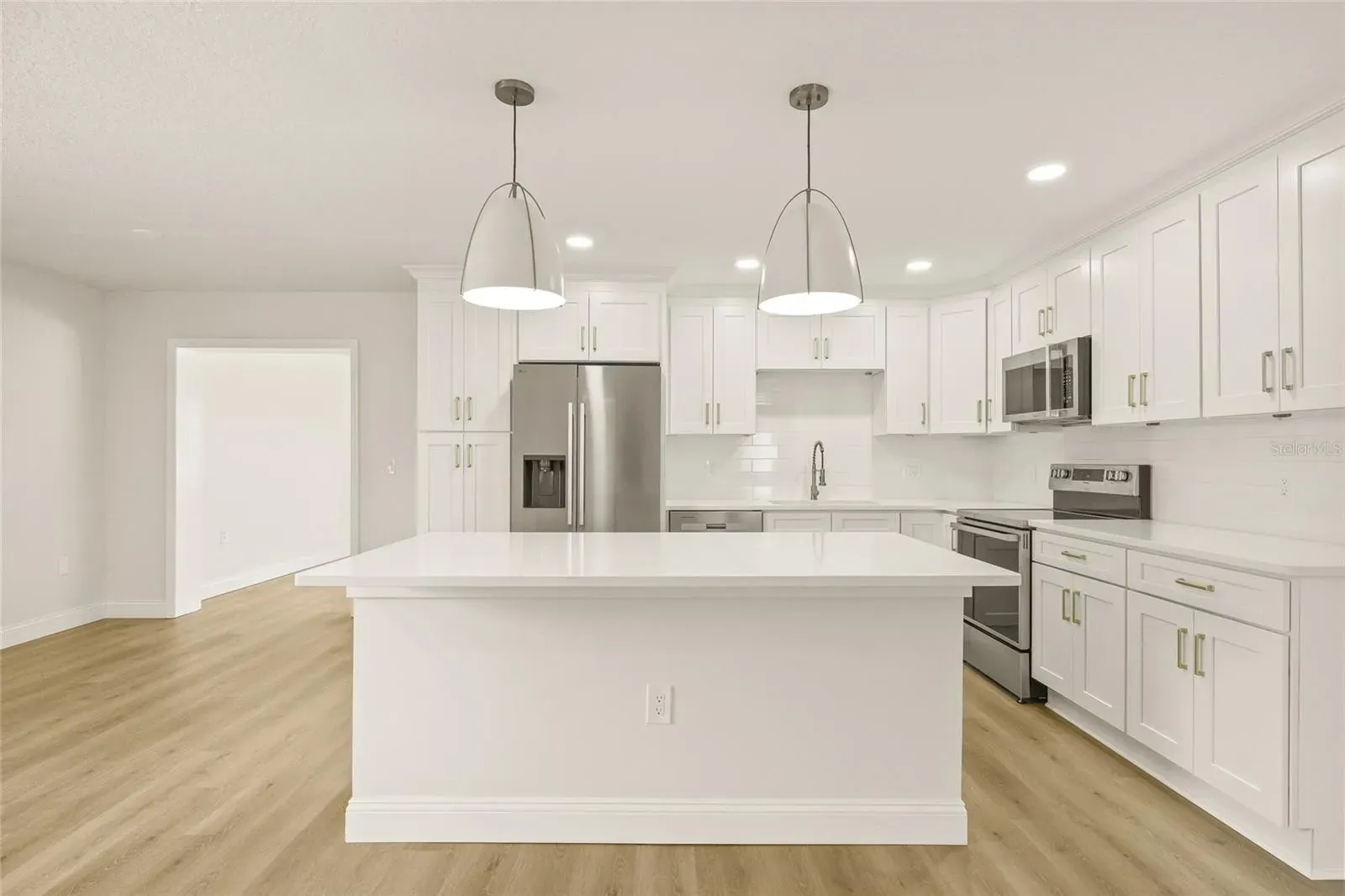 LVP kitchen white shaker cabinets Holiday FL
