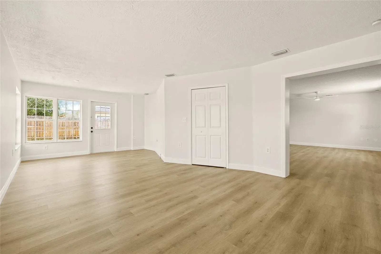 LVP living room with entry Holiday FL