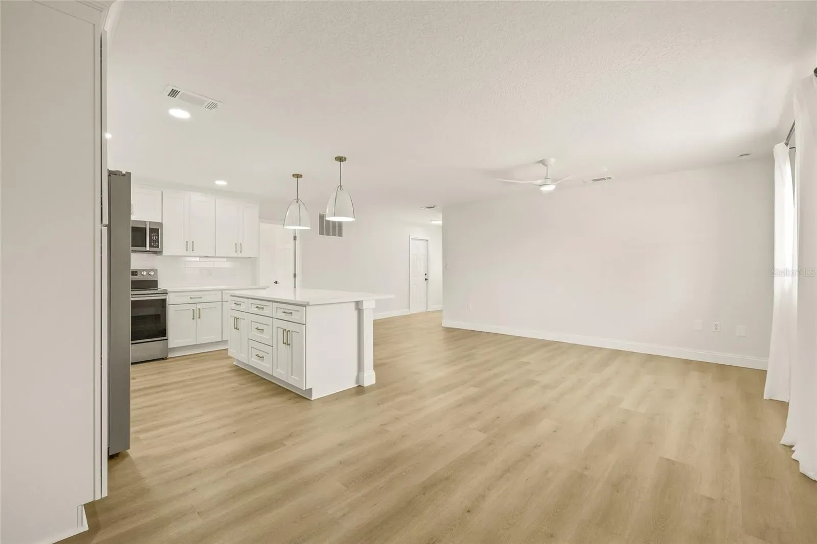 LVP open plan kitchen living area Holiday FL