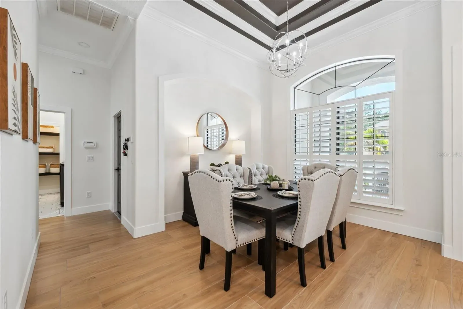 Tile flooring in dining room with tray ceiling — Holiday, FL