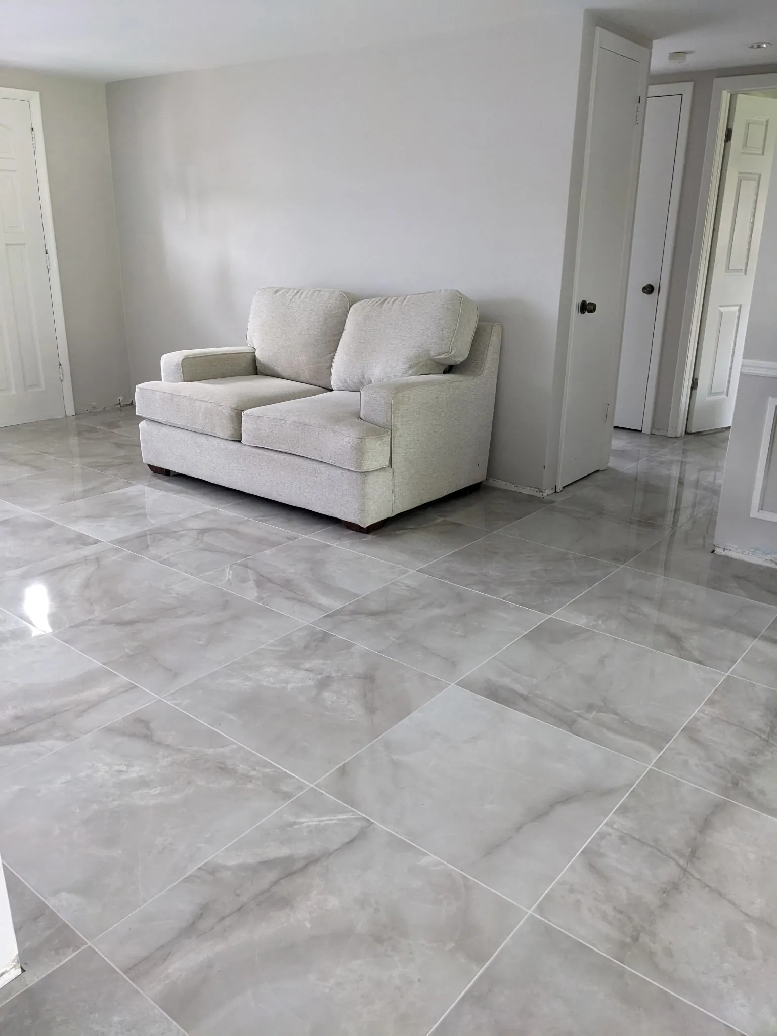 Marble look polished tile living room Holiday FL