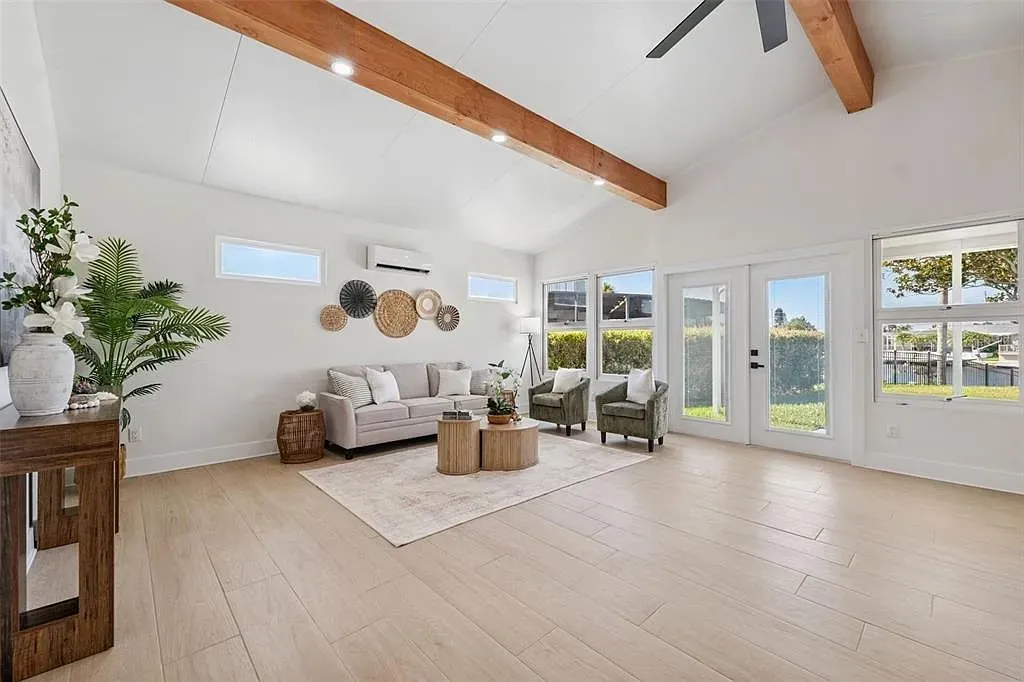 Wood-look tile living room vaulted beams Holiday FL