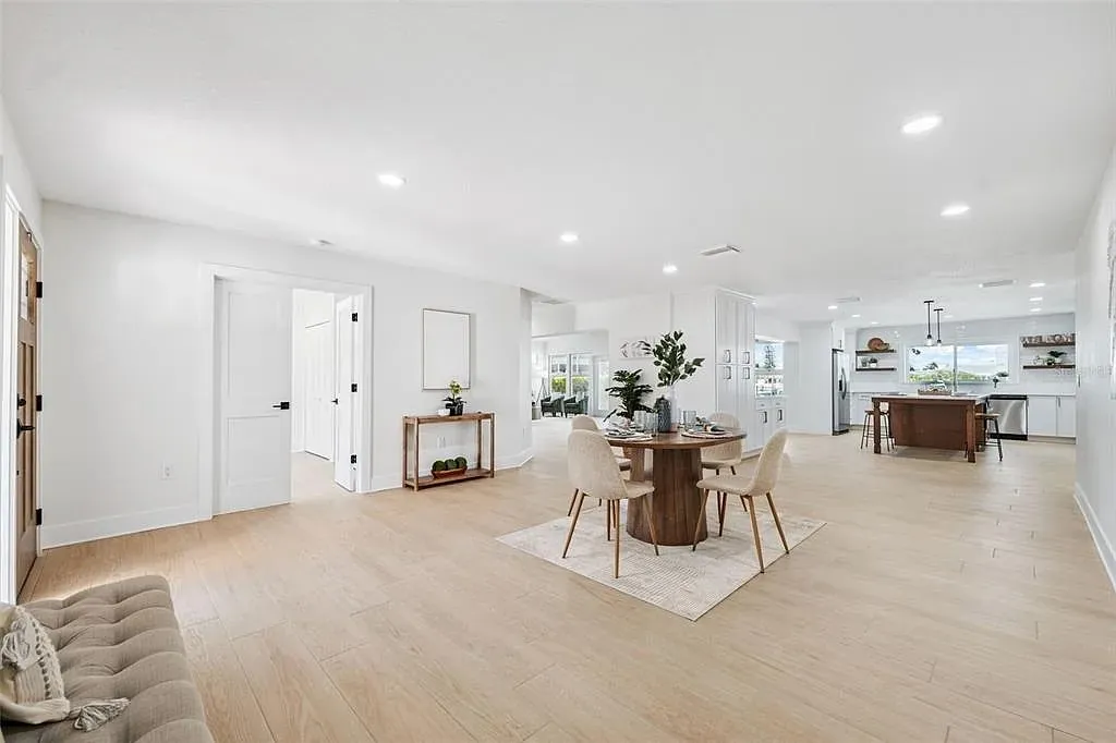 Wood-look tile open plan dining kitchen Holiday FL