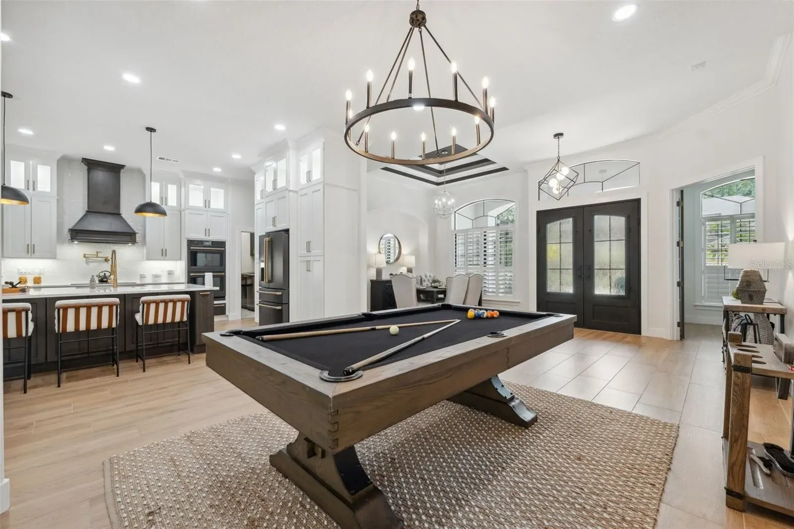 Open plan kitchen game room tile Holiday FL